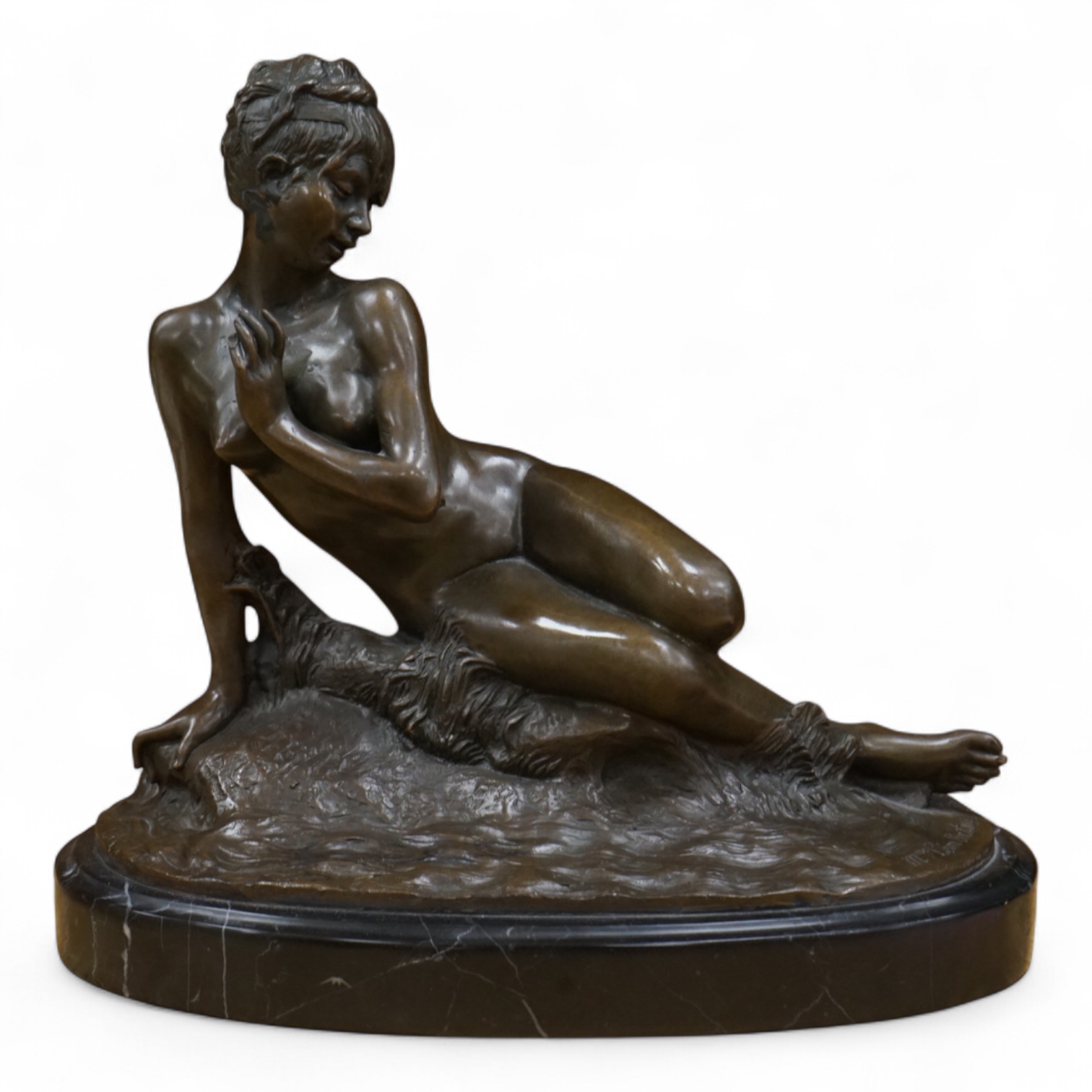 After Mme Leon Bertaux, bronze of a female reclining nude with butterfly, 28cm wide x 27cm high.